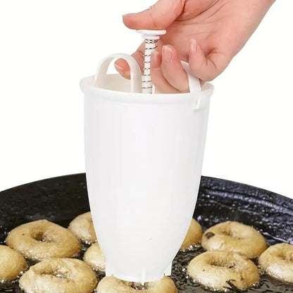 Dispenser pentru dozarea aluatului de gogoși